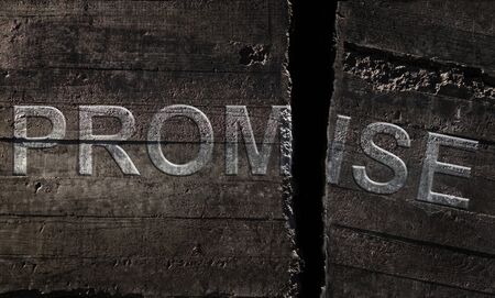 Promise text broken on textured stone background -- broken promises concept                               の写真素材
