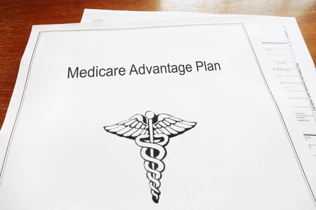 Medicare Advantage retirement healthcare document on a deskの写真素材