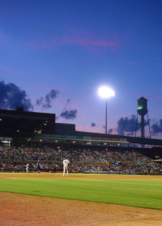 DURHAM,NC/USA - 07-09-2016: The Durham Bulls baseball team playing a night game at the Durham Bulls Athletic Park, known as the DBAP, in downtown Durham, NCのeditorial素材