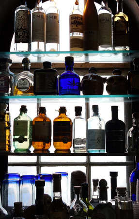 NEW ORLEANS,LA/USA -03-23-2019: Bottles of tequila and mezcal on shelves of the Casa Borrego bar and restaurant in New Orleansのeditorial素材