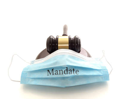 Court legal gavel and facemask with Mandate text isolated on white -- Coronavirus mask mandate conceptの写真素材