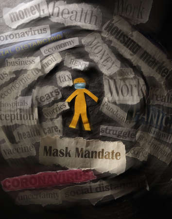 Masked paper cutout person with Mask Mandate news headline and surrounded by COVID related headlinesの写真素材