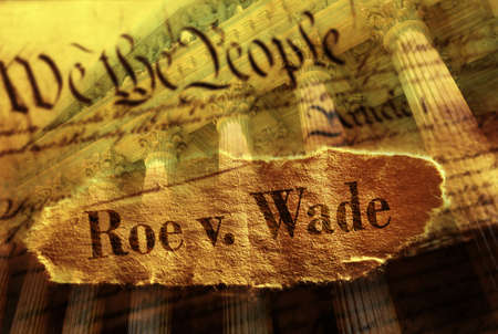 Roe V Wade newspaper headline on the US Constitution with the United States Supreme Court in backgroundの写真素材