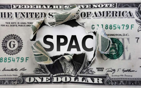SPAC - Special Purpose Acquisition Company -- text on a torn dollar billの写真素材