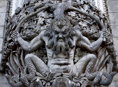 Carved stone figure of a sea monster in a wall at the Palacio da Pena, Sintra, Portugal. Pena National Palace (Palacio Nacional da Pena) the oldest palace inspired by European Romanticism. Located on the top of a hill above the town of Sintra, Portugal. Uのeditorial素材