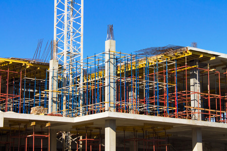 Colorful building construction site against blue sky