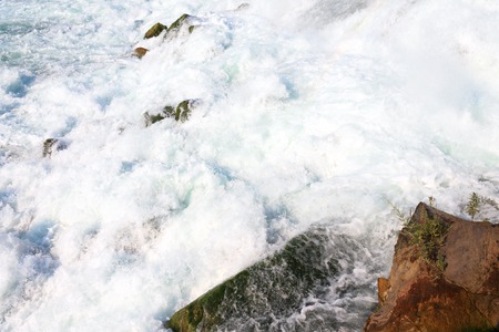 Close up shot of the water falling at Niagara Falls State Park in New York, USA, showing the power and strength of the water as it breaks on the bottom into the Niagara river.の写真素材