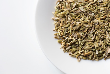 seeds of fennel in white plateの写真素材