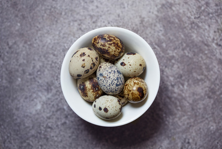 some eggs of quail on the stone backgroundの写真素材