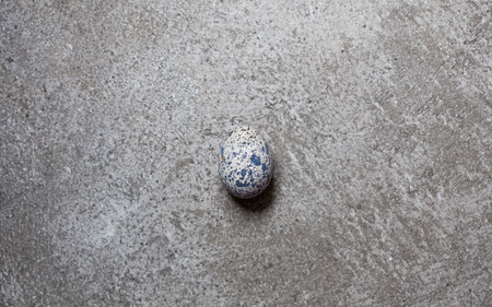 egg of quail on the stone backgroundの写真素材