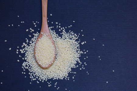 some couscous on wooden spoonの写真素材