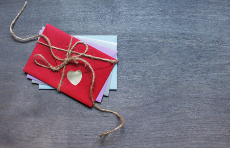 Some different envelopes on dark wooden background. Top viewの写真素材