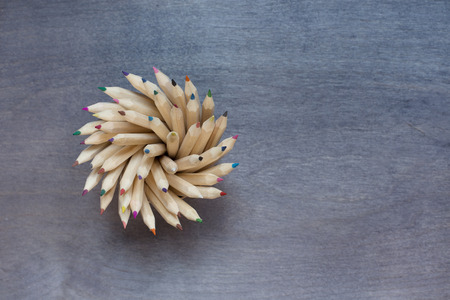 Some pencils on dark wooden background. Top viewの写真素材