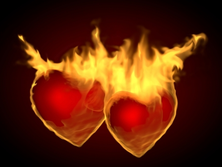 Two flaming hearts on fire, on a dark backgroundの写真素材