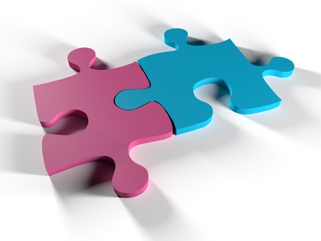 Two puzzle pieces that represent man and woman uniteの写真素材