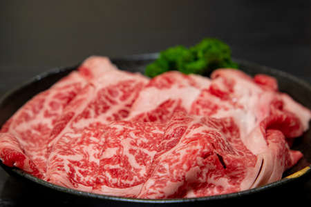 Beef shoulder loin for sukiyakiの写真素材