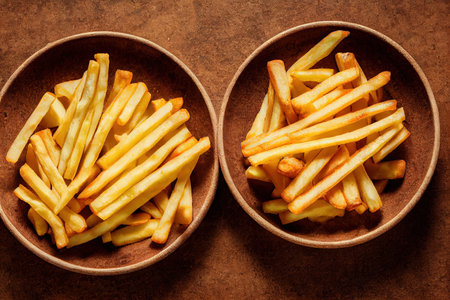 Golden fried potato sticks and sauces in bowls on a wooden background 3d illustration