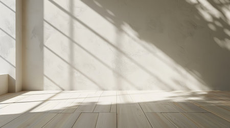 3D rendering of an empty room with a wood laminate floor and sun light casting a shadow on the wall. This is a perspective of a minimalist interior design.の写真素材