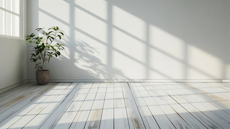A mockup of an empty room with a laminate flooring and the shadow cast by the sun on the wall in a minimalist design perspective.の写真素材