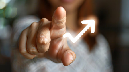 Businessmans finger pointing to an arrow. Plan for success, profit, and growth.の素材