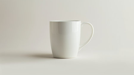 An empty white mug on a white background.の素材