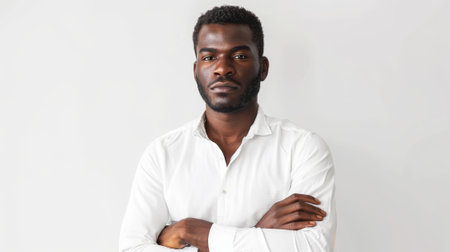 Stunning black male portrait isolated on a white background, circa late 20s.の素材