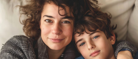 This is a photograph of a mother and her teenager. There is tenderness and love in this photograph.の素材