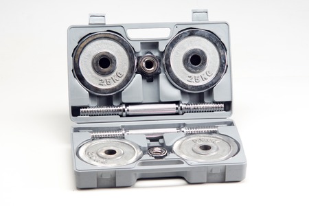 Completely disassembled dumbbells in box isolated on white backgroundの写真素材