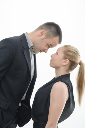 Colleagues shouting against each other, man is dominating over woman, isolated on white backgroundの写真素材