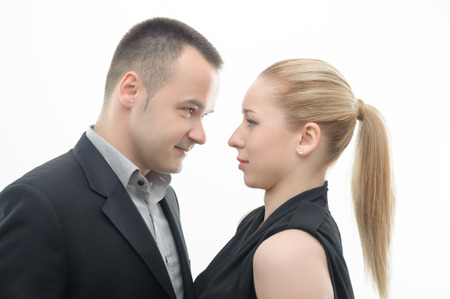 Colleagues shouting against each other, man is dominating over woman, isolated on white backgroundの写真素材