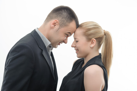Colleagues shouting against each other, man is dominating over woman, isolated on white backgroundの写真素材