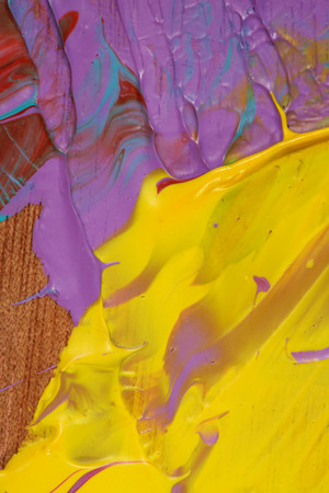 Close-up view of Abstract acrylic painted multicolored convex background in yellow and purple, red colorsの写真素材