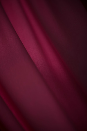 Close-up view of purple soft chiffon tulle with curve and wave texture backgroundの写真素材