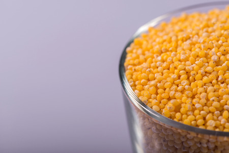 Composition of glass with millet isolated on white background with copy place selective focusの写真素材