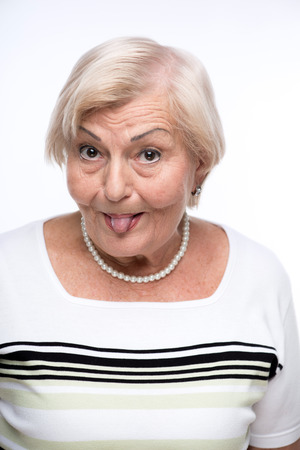 Naughty granny making facesの写真素材