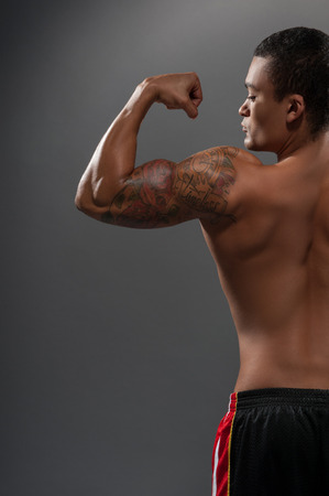 Young handsome African man posing shirtlessの写真素材
