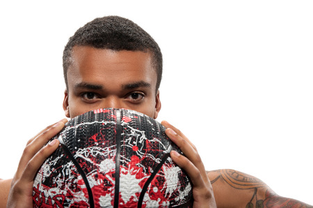 Young African sportsman playing basketballの写真素材