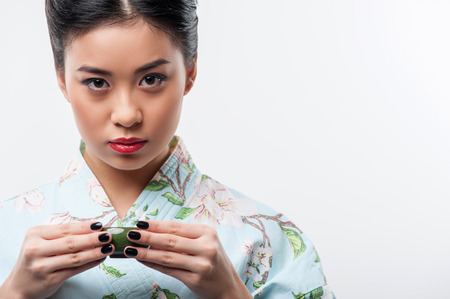 Tea ceremony conducted by Asian womanの写真素材