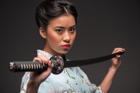 Japanese woman with katanaの写真素材
