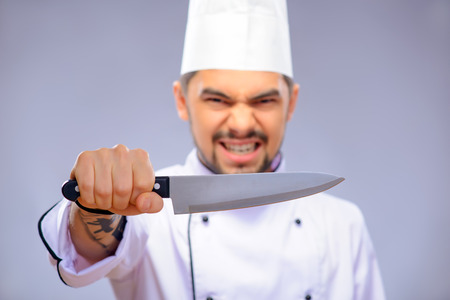 Portrait of young handsome cook