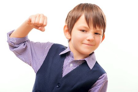 Cute child in suit showing the fist