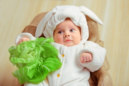 Adorable little baby in a funny bunny bodysuit