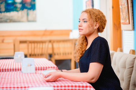 Beautiful woman in the cafeの写真素材