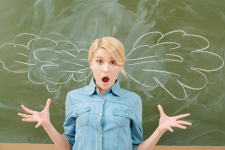 Brain blow. Female student getting her brains blow with vapor chalk drawing on backboardの写真素材