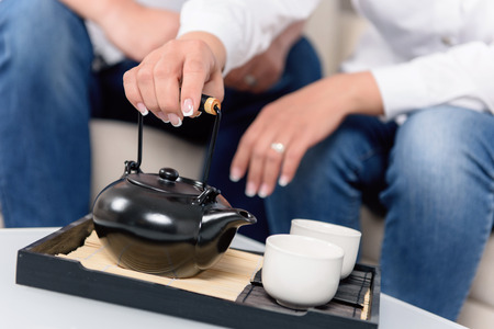 New time old traditions.  Asian tea ceremony in modern timeの写真素材