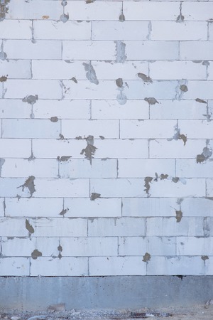 Brick.  A wall of brick of an undone building, picture may be used as a backgroundの写真素材