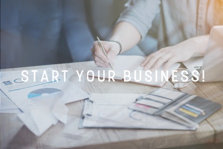 Friendly colleagues. Two happy and delighted young men holding darts and having funの写真素材
