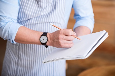 Business plan. Cropped image of man making some notesの写真素材