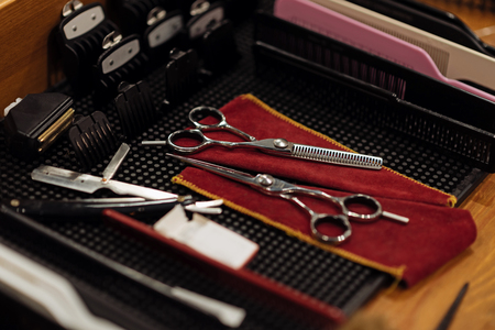 Brand new. Top view of new professional tools of barber lying on table.の写真素材