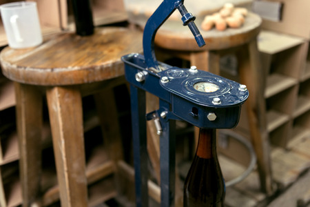 Close up of alcohol bottle being sealed